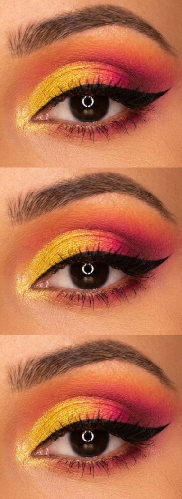 Close-up of an eye with a bold sunset-inspired eyeshadow look, featuring a gradient from yellow to pink and orange, complemented by thick black eyeliner.