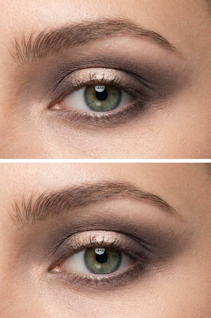 Eyelid makeup with a halo effect using beige-gold shimmer at the center and misty brown-grey shades smoked out around it.