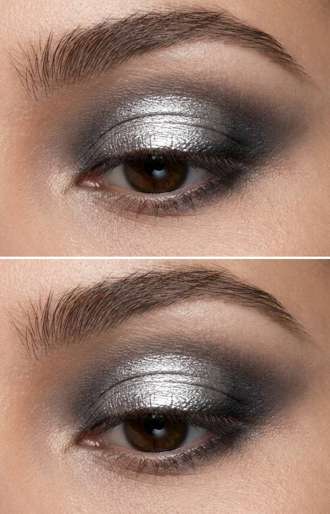 Close-up of an eye with metallic silver eyeshadow and dark smoky makeup.