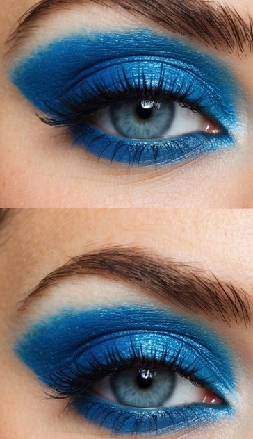 A close-up of a vibrant blue eyeshadow palette with various shades and textures, arranged in a visually appealing manner