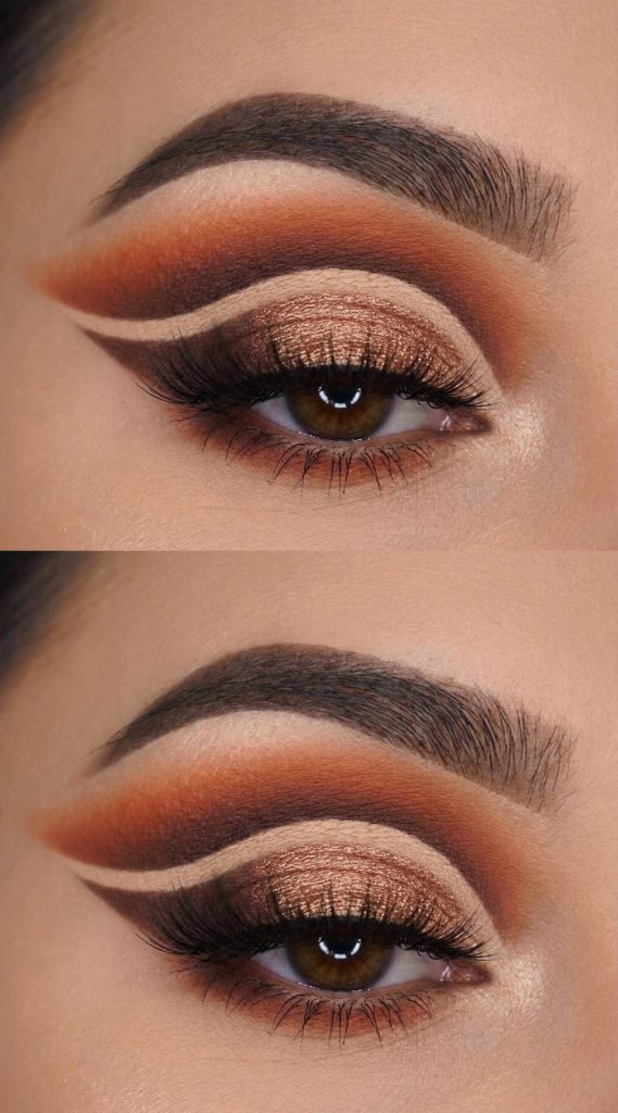 Bronze and rust eyeshadows blended into a wing with a sharp nude crease line in this polished full cut crease eye makeup idea.