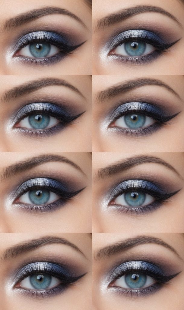 Close-up of blue eyes featuring an eye makeup idea for blue eyes with silver-blue shimmer eyeshadow, smokey gray edges, crisp winged eyeliner, and voluminous lashes.