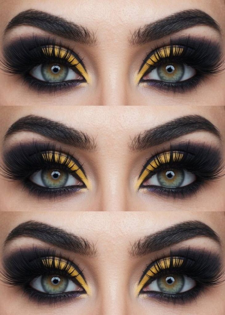 Close-up of green eyes with dramatic makeup, featuring bold yellow and black eyeshadow and thick, full eyelashes, repeated three times in the image.