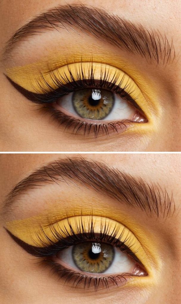 Citrus-yellow shadow blended across the lid with a clean extended liner, offering graphic yellow eye makeup ideas with subtle lash detail.