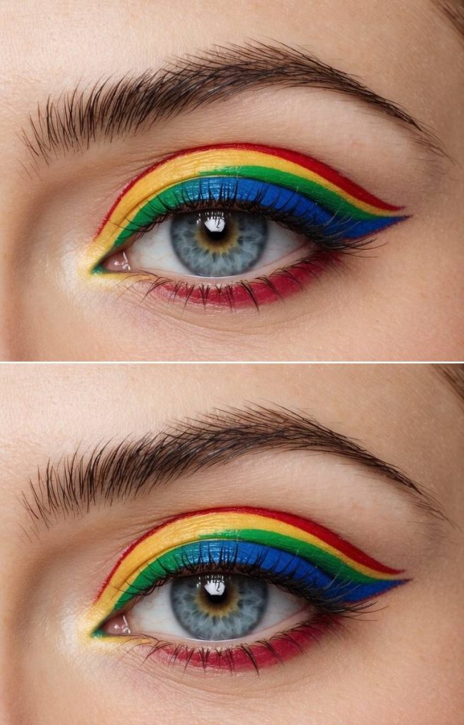 Colorful eye makeup look featuring layered rainbow eyeliner in red, yellow, green, and blue, with blue lower-lash definition and soft red shading under the eye.