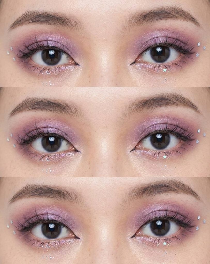 Close-up of Douyin eye makeup trend featuring lilac shimmer eyeshadow and silver star-shaped sequins under the eyes for a dreamy, starry look.