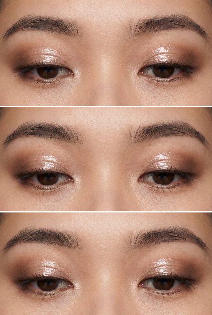 Monolid eye makeup idea with warm brown shadow diffused across the lids, topped with a clear gloss for a wet, luminous texture.
