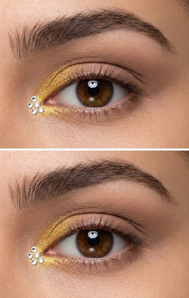 Bright yellow inner corner shimmer with curved rhinestone detailing in a soft, sunny rhinestone eye makeup idea.