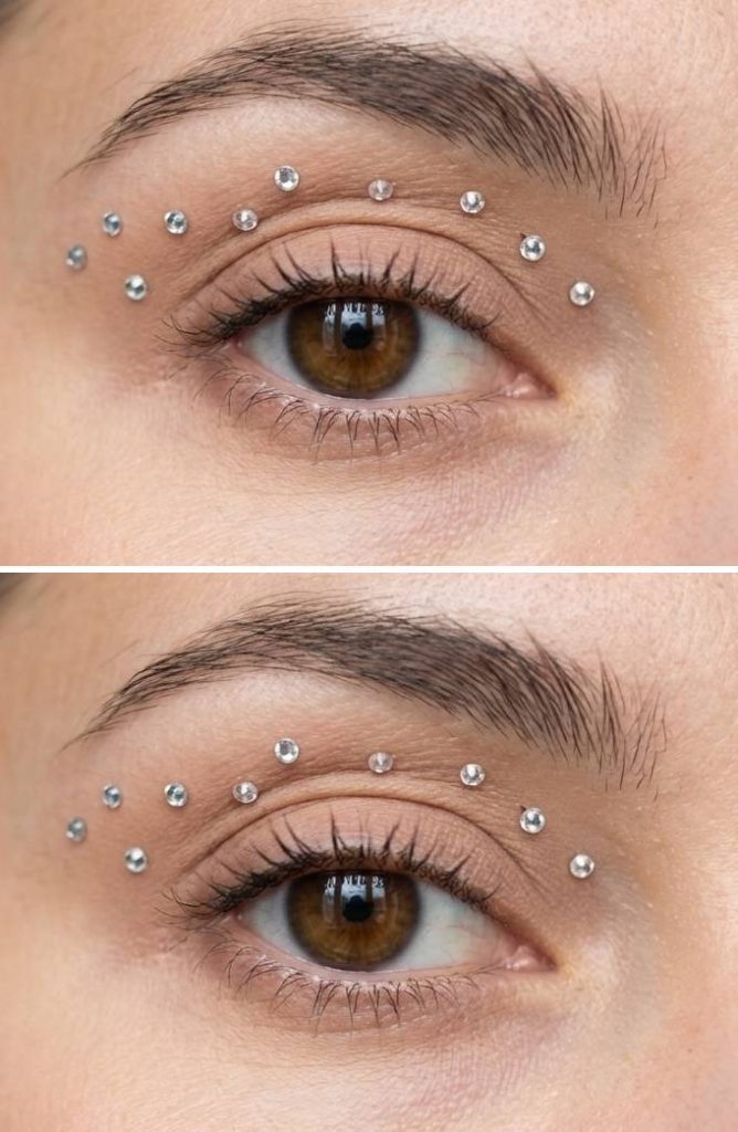Nude eyelid with rhinestones arranged in two soft arches above the crease in a floating rhinestone eye makeup idea.