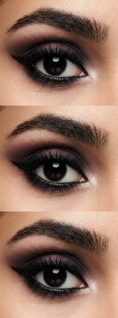 Smokey trad goth eye makeup look using plum shimmer on the lids, blended with black in the crease and under the eyes, plus silver in the tear duct.