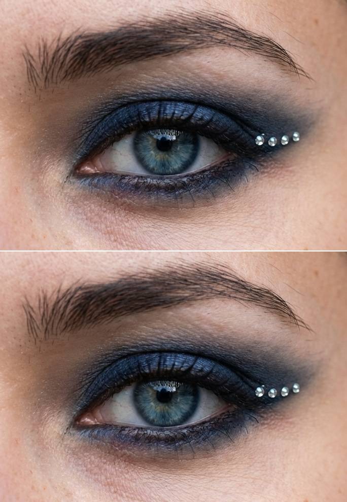 Intense navy eyeshadow look with five small rhinestones lined along the outer edge in a modern rhinestone eye makeup idea.