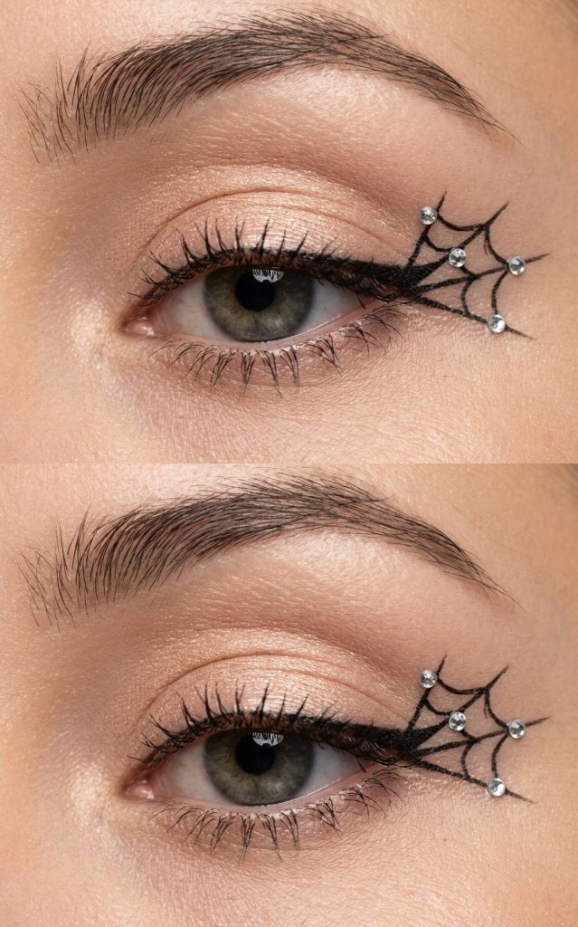 Detailed image of a spiderweb eye makeup idea featuring peach-toned shimmer, precise black webbed eyeliner, and rhinestones on the outer lash line.