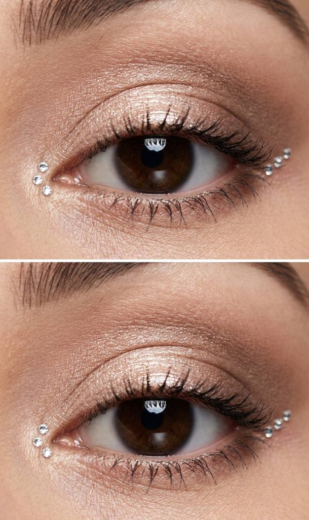 Beige and bronze shimmer lid with rhinestone accents at the eye’s inner and outer corners in a minimalist rhinestone eye makeup idea.