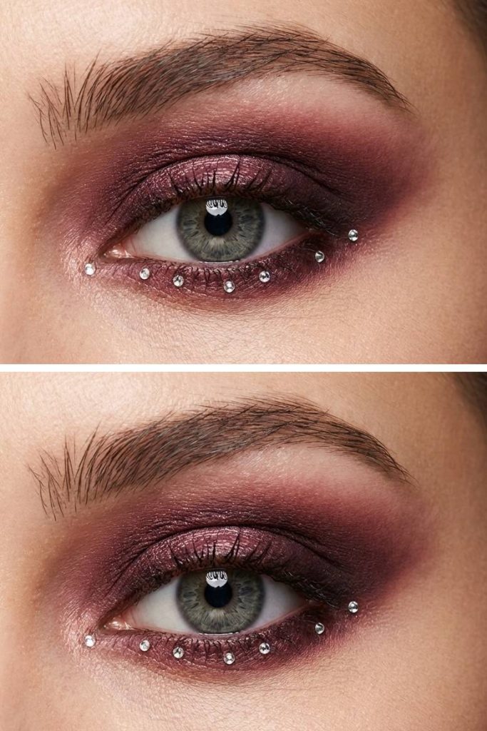 Deep plum shimmer eyeshadow with rhinestones lining the lower lash line in this elegant rhinestone eye makeup idea.
