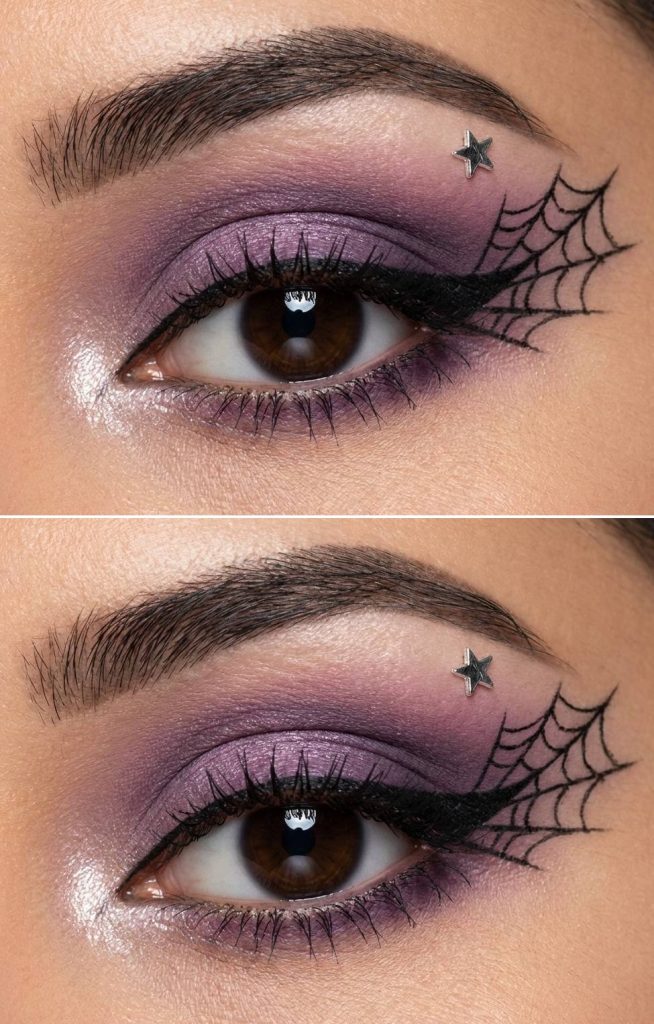 Eye-focused image of a spiderweb eye makeup idea with violet shimmer, black spiderweb eyeliner art, and a metallic star sticker on the upper outer lid.