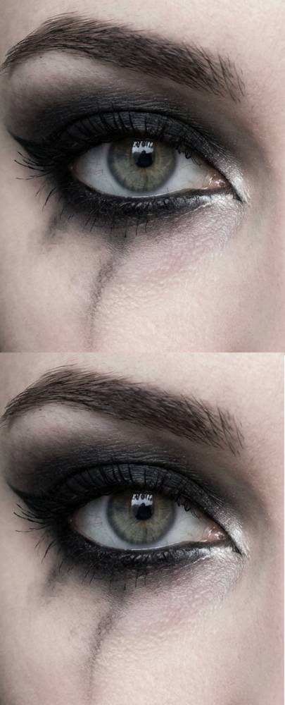 Trad goth eye makeup look with silver shimmer on the inner corner, smoky black on the lid, and streaked under-eye shadow resembling tear stains.