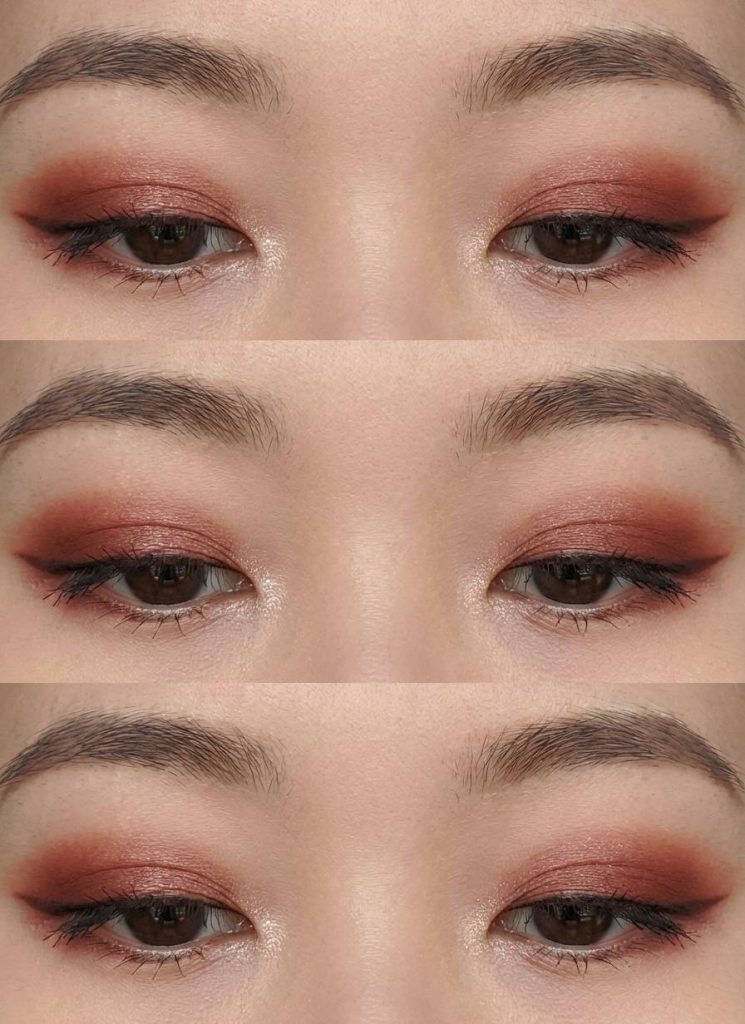 Monolid eye makeup idea with warm reddish-brown eyeshadow and a soft smoky blend, paired with subtle shimmer in the inner corners.