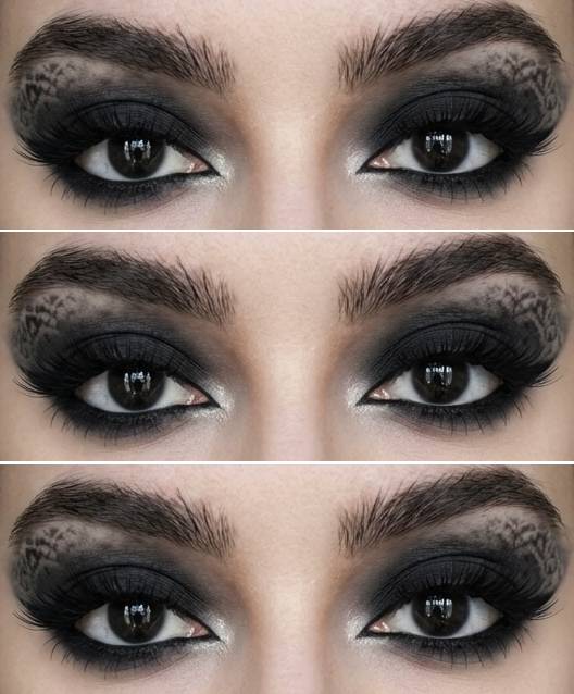Trad goth eye makeup look with deep black smokey shadow and faint lace-inspired patterns extending above the crease toward the brows.