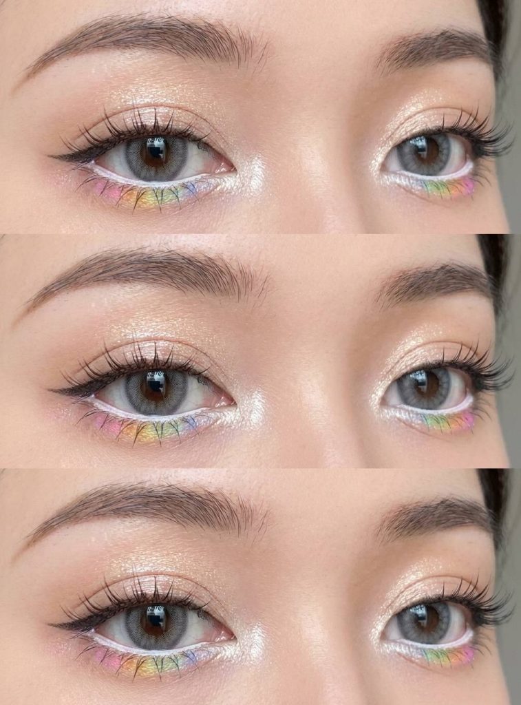 Anime-inspired makeup with shimmering champagne eyelids and soft rainbow eyeshadow delicately lining the lower lash line for a dreamy, pastel effect.