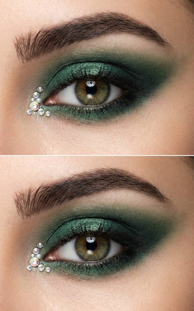 Green metallic eyeshadow faded into dark green, accented by a rhinestone cluster near the tear duct in an elegant rhinestone eye makeup idea.