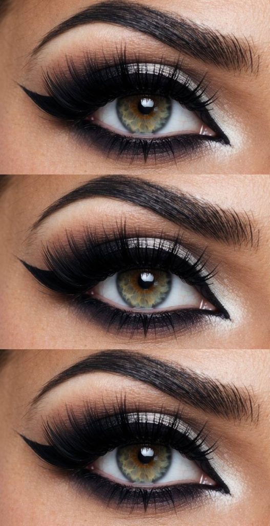 Close-up of a bold gyaru eye makeup look combining layered black eyeshadow, inner-corner white shimmer, and ultra-dramatic false lashes.
