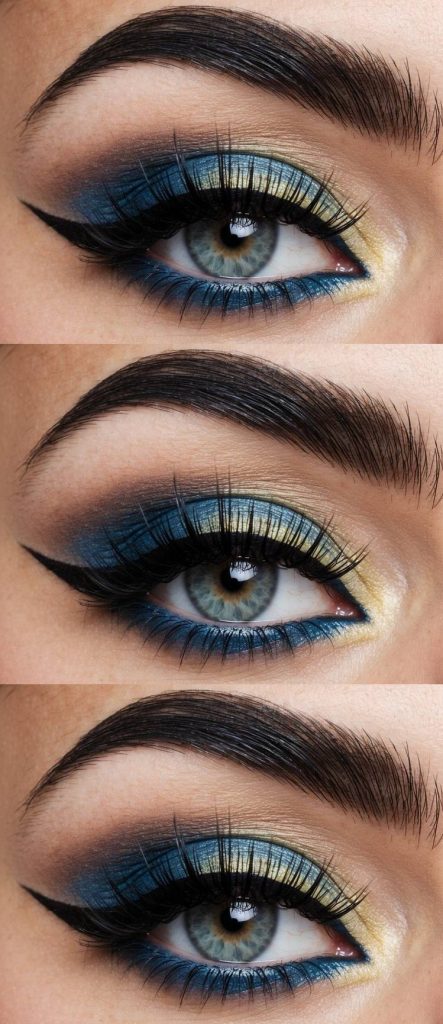 Gyaru eye makeup look featuring yellow shimmer on the inner corners, blended into vivid ocean blue lids and defined with sharp winged liner.