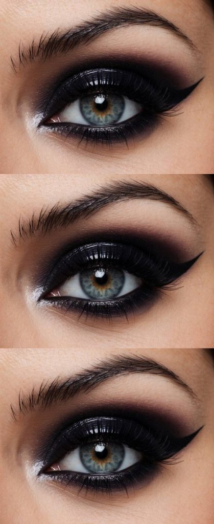 Close-up of a trad goth eye makeup look with black smoky shadow, diffused edges, and a soft silver inner corner highlight.