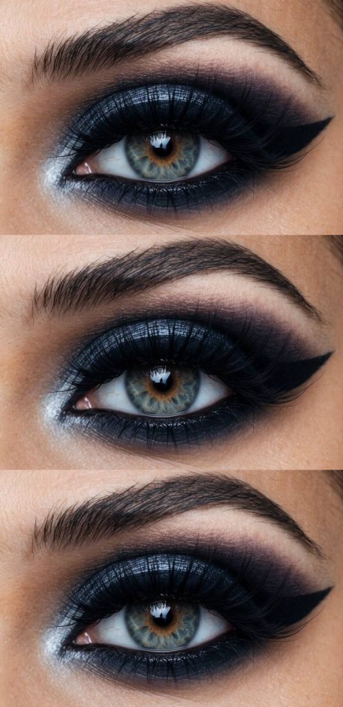 Trad goth eye makeup look with navy blue and black shadow gradient, metallic silver in the inner corners, and a thick outer wing liner.