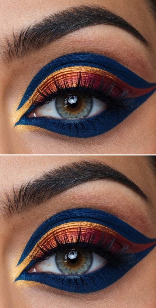 Crazy eye makeup looks with navy winged liner, fiery red-orange gradient, and golden shimmer cutting through for a royal, graphic finish.